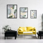 Styled living room wall with multiple wooden art pieces